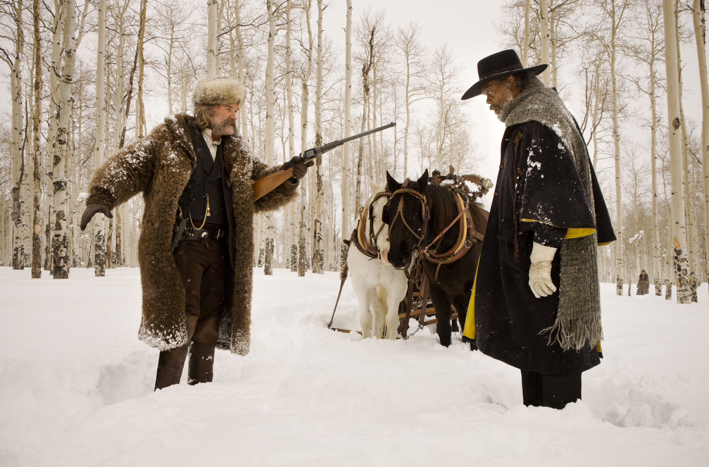 (L-R) KURT RUSSELL and SAMUEL L. JACKSON star in THE HATEFUL EIGHT. 
Photo: Andrew Cooper, SMPSP
© 2015 The Weinstein Company. All Rights Reserved.