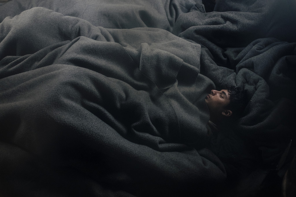 Lives in Limbo © Francesco Pistilli // Afghan boys sleeping in an abandoned train wagon next to the main Belgrade's rail station.